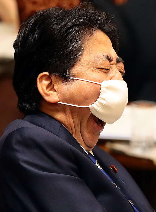 Budget Committee of the House of Councillors Prime Minister Shinzo Abe yawns so hard he can t hide it with his Abeno mask during a Upper House Budget Committee meeting, June 11, 2020, in the Diet.