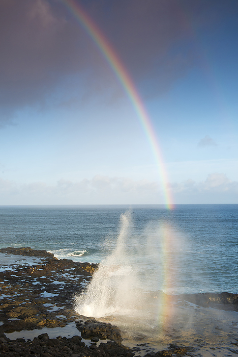 Spouting Horn with a morning rainbow, on the south coast of Kauai, Hawaii, USA, near Po ipu Spouting Horn with a morning rainbow, on the south coast of Kauai near Poipu, Kauai, Hawaii, United States of America, North America, Photo by Shanna Baker