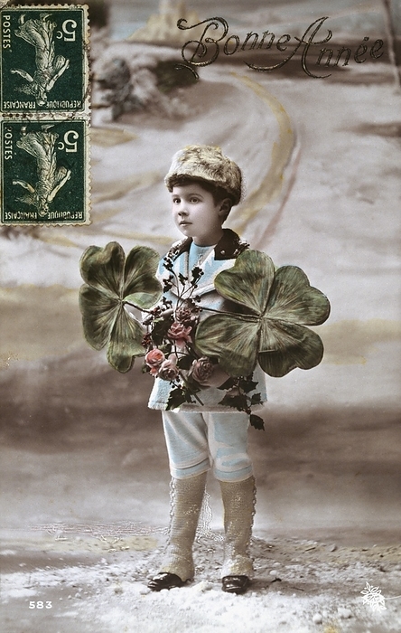 French Happy New Year, postcard depicting a boy with flowers and a four leaf clover. 1900