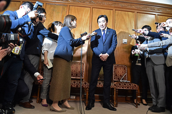 Former Minister of Economy, Trade and Industry Kazuhide Sugawara  center  answers questions from reporters before the opening of the regular Diet session. Former Minister of Economy, Trade, and Industry Kazuhide Sugawara  center  answers reporters  questions before the opening of the regular Diet session at 10:59 a.m. on January 20, 2020, in the National Diet.