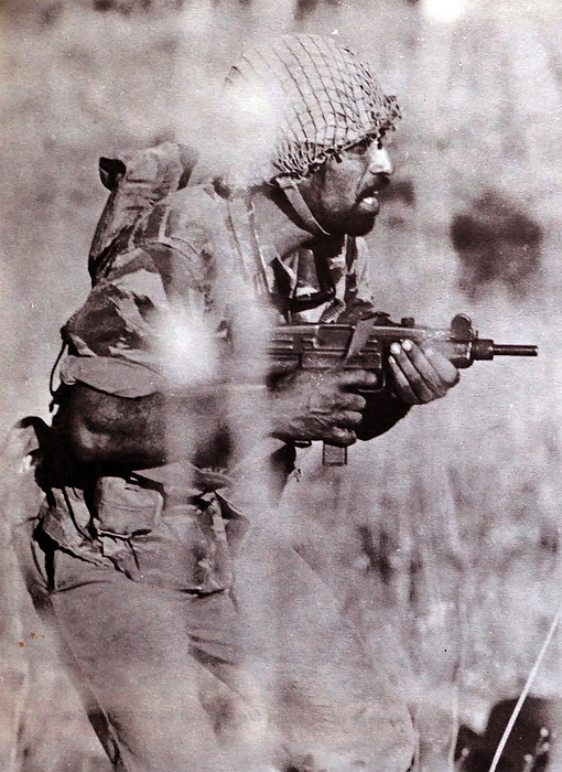 Israeli infantry assault on Syrian positions in the Golan Heights  1967 Israeli infantry soldier with Uzi sub machine gun, during the assault on Syrian positions in the Golan Heights, during the 1967 Six Day War