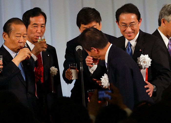 Fumio Kishida  right , chairman of the LDP Policy Research Council, smiles after a toast at the LDP Kishida faction s party  Talking with Koikekai. On the left is Toshihiro Nikai, secretary general of the LDP. Fumio Kishida, LDP policy chief  right  smiles after a toast at the LDP Kishida faction s party  Talking with Koikekai. On the left is Toshihiro Nikai, secretary general of the LDP, photographed by Yuki Miyatake on May 15, 2019 in Minato Ward, Tokyo.