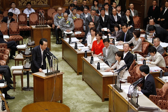 One night after the rejection of the no confidence vote in the Cabinet Intensive deliberation in the House of Councillors is a needle in a haystack June 3, 2011, Tokyo, Japan   Japanese Prime Minister, sanding at left, speaks during an upper house budget committee meeting in the Diet in Tokyo on Friday, June 3, 2011, the day after he has survived a non confidence motion brought against him by opposition parties. Survived though he has, the political outlook for the lame duck administration remains bleak as Kan is unlikely to gain the opposition camp s cooperation necessary to pass various key bills in the divided Diet.  Photo by AFLO   3609   mis 