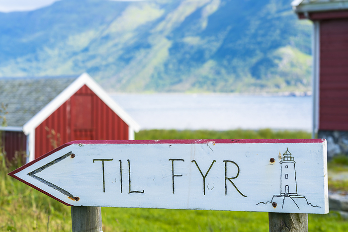 Norway Wood signage showing directions for Hogsteinen Lighthouse, Godoya Island, Alesund, More og Romsdal County, Norway, Photo by Roberto Moiola