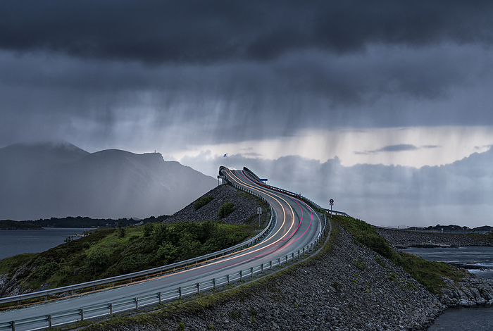 Norway Storm clouds over car lights trails on Storseisundet Bridge, Atlantic Road, More og Romsdal county, Norway, Photo by Roberto Moiola