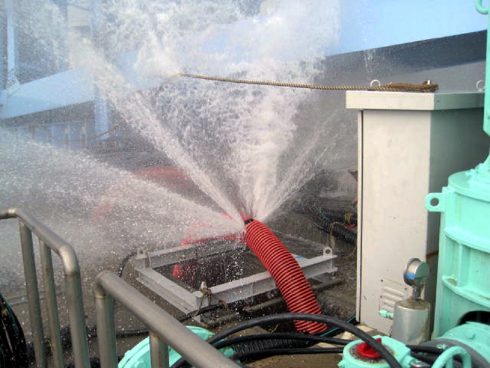 Fukushima Daiichi Nuclear Power Plant Accident Water spurts from hose at Unit 5  Image provided by TEPCO  July 3, 2011, Okumamachi, Japan   Seawater gushes from the ruptured hose connected to one of the two outside temporary seawater cooling pumps of the residual heat removal system for the No. 5 reactor unit at the Fukushima No. 1 nuclear power plant in Okumamachi, Fukushima Prefecture, some 210km northeast of Tokyo, on Sunday, July 3, 2011.   Some three hours after the leakage was found by an employee of the Tokyo Electric Power Co., the plant operator known as TEPCO, the cooling pump and the residual heat removal system were stopped for replacing the busted water pipe, said the TEPCO. The temperature inside the reactor unit rose slightly before the cooling operations resumed. The Photo was released by TEPCO on July 3.  Photo by TEPCO AFLO   0006   mis 