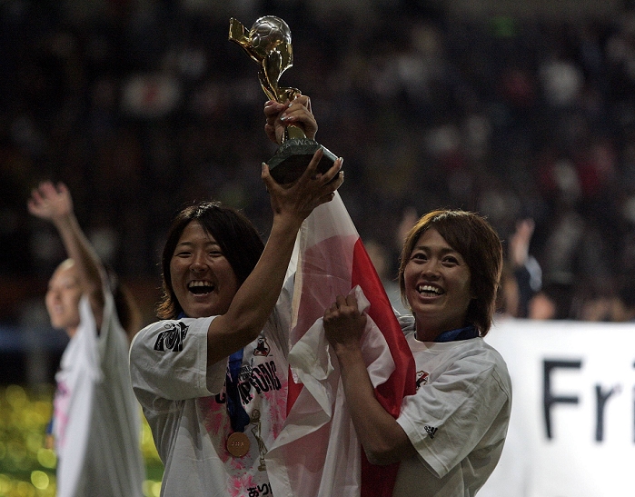 2011 FIFA Women s World Cup Nadeshiko Japan wins first place  L R  Yuki Nagasato, Kozue Ando  JPN , JULY 17, 2011   Football : Yuki Nagasato and Kozue Ando of Japan celebrate with the trophy after winning Yuki Nagasato and Kozue Ando of Japan celebrate with the trophy after winning the FIFA Women s World Cup Germany 2011 Final match between Japan 2 3 1 2 United States at Commerzbank Arena in Frankfurt, Germany.
