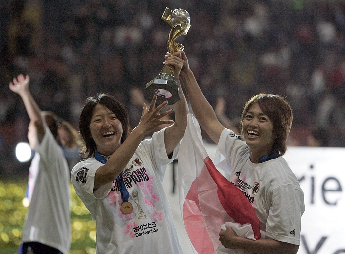 2011 FIFA Women s World Cup Nadeshiko Japan wins first place  L R  Yuki Nagasato, Kozue Ando  JPN , JULY 17, 2011   Football : Yuki Nagasato and Kozue Ando of Japan celebrate with the trophy after winning Yuki Nagasato and Kozue Ando of Japan celebrate with the trophy after winning the FIFA Women s World Cup Germany 2011 Final match between Japan 2 3 1 2 United States at Commerzbank Arena in Frankfurt, Germany.
