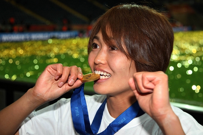 2011 FIFA Women s World Cup Nadeshiko Japan wins first place Kozue Ando  JPN , JULY 17, 2011   Football : Kozue Ando of Japan bites on her gold medal after winning the FIFA Women s World Cup Germany 2011 Final match between Japan 2 3 1 2 United States at Commerzbank Arena in Frankfurt, Germany.