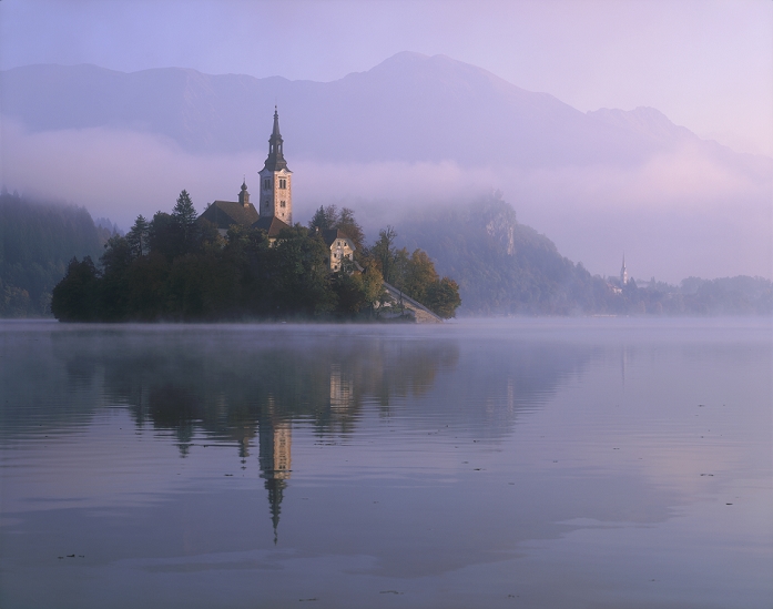 Lake Bled and St. Mary's Church in the morning mist, Slovenia