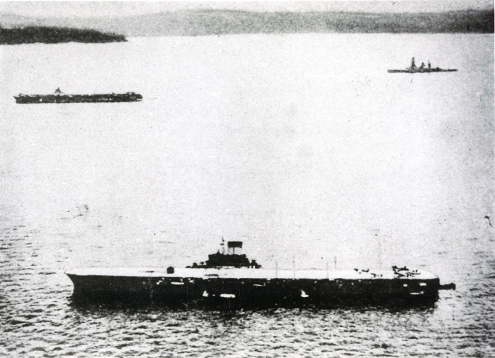large phoenix  Date of photograph unknown  Undated   Japanese aircraft carrier Taiho is shown in a center. Taiho was laid down on 10 July 1941, launched almost two years later on 7 April 1943 and finally commissioned on 7 March 1944. She was sunk on 19 June 1944 during the Battle of the Philippine Sea after suffering a single torpedo hit from the American submarine USS Albacore.  Photo by Kingendai Photo Library AFLO 