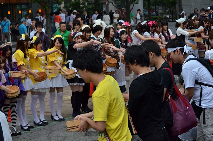 Uchimizu Event in Akihabara 50 maids and others participated  July 31, 2011, Tokyo, Japan   Maid cosplayers and fans sprinkling water together: This summer, Japan is concerned for saving electricity due to the Fukushima nuclear plant disaster. Maids cos players are doing water sprinkling to make the temperature cooler in Akihabara, Japan.  Photo by Yumeto Yamazaki AFLO 