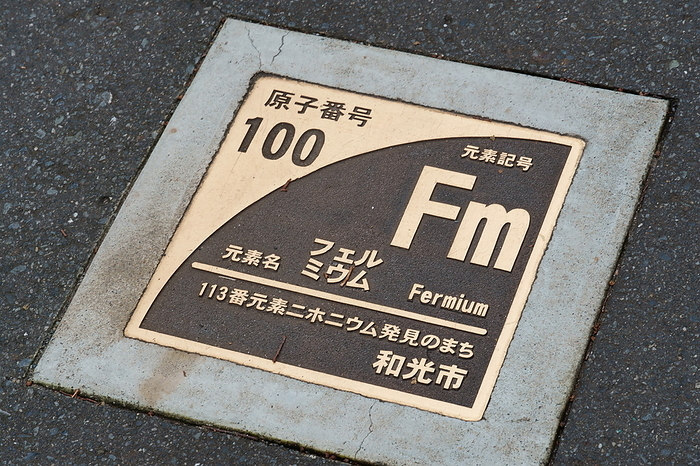 Plate with names of elements embedded in Nifonium Street, Wako shi, Saitama, Japan Atomic number 100 Fm Fermium Element Niphonium Nh  Atomic number 113  City of discovery Wako, Saitama Prefecture