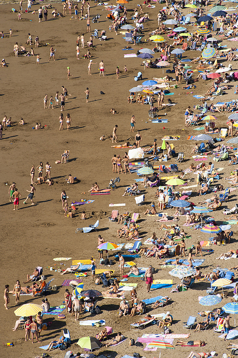 People Sunbathing At Itzurun Beach, Zumaia, Basque Country, Spain Photo by Dosfotos / Design Pics