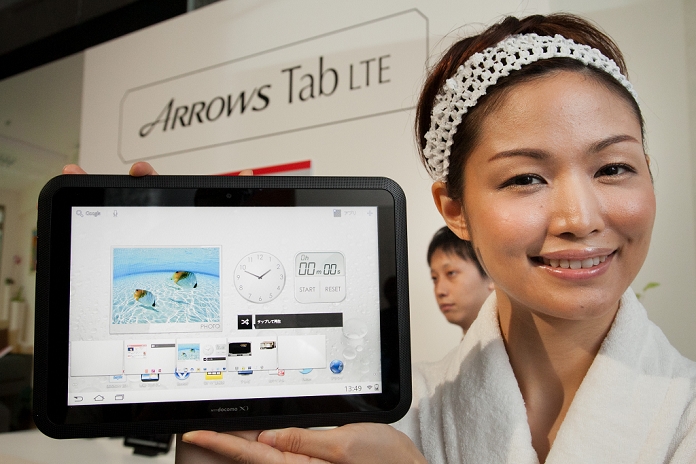 Two New Tablet Models Released Compatible with docomo s high speed communication September 8, 2011, Tokyo, Japan   A model shows off Fujitsu Arrows Tab LTE, one of the two new tablet devices compatible with its extra high speed next generation Long Term Evolution service during a launch by Japan s NTT Docomo in Tokyo on Thursday, September 8, 2011.   Arrows Tab LTE and Samsung s Galaxy Tab 10.1 LTE will go on sale in Japan in October. Both tablets, featuring large 10.1 inch displays, are powered by dual core CPUs running on Android 3.2.  Photo by AFLO   3609   mis 