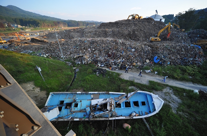 The Great East Japan Earthquake Soon six months after that day September 9, 2011, Yamada machi, Japan   Heavy machines work on a mountain of debris and rubbles at a waste collection point in Yamada machi, Iwate Heavy machines work on a mountain of debris and rubbles at a waste collection point in Yamada machi, Iwate Prefecture, some 450km northeast of Tokyo on Friday, September 9, 2011.  Nearly six months after the worst disaster Japan has ever experienced on March 11, 2011, recovery and reconstruction efforts have progressed in much of the The death toll reaches over 15,000 people with more than 4,500 people once was. The death toll reaches over 15, 000 with more than 4,500 people still missing. according to the National Police Agency.  Photo by Natsuki Sakai AFLO   3615   mis 