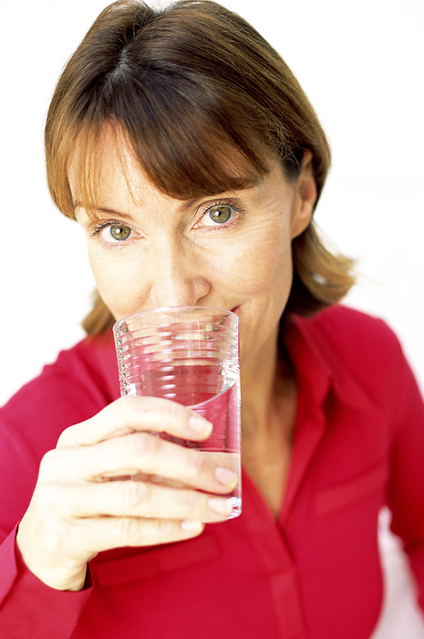 Drinking water MODEL RELEASED. Woman drinking water.