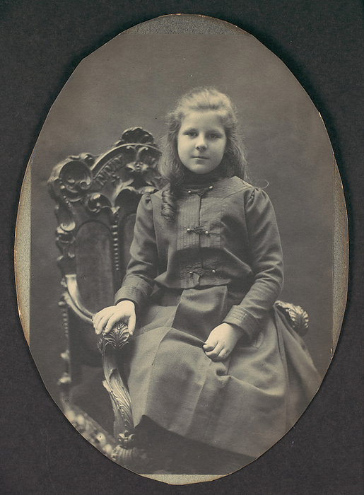  Girl with Ringlets, Seated, Three Quarter Length , 1890s. Creator: Frederick Gutekunst.  Girl with Ringlets, Seated, Three Quarter Length , 1890s.