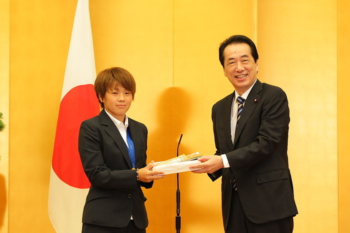 National Honor Prize Awarded to World Cup Winners Nadeshiko Japan Japan women s national football team player Aya Miyama  L  receives the People s Honor Award gifts from Japanese Prime Minister Naoto Kan during an award ceremony at the premier s official residence in Tokyo, Japan, August 18, 2011. Japan won the FIFA Women s World Cup Germany 2011.  Photo by JFA AFLO 