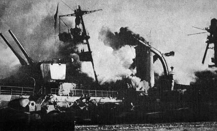 Sinking of the French fleet Black and white photograph of World War II  1939 1945   the intentional sinking of the French fleet in Toulon, with a photo of the French ship  Dupleix  in flames.