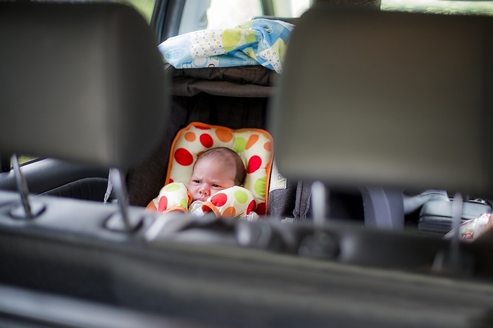 New born baby in a car seat New born baby in a car seat.