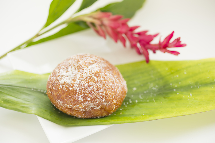 Fresh Malasada (a Portuguese dessert that is popular in Hawaii) served on Ti leaf, Hawaii.