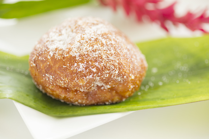 Fresh Malasada (a Portuguese dessert that is popular in Hawaii) served on Ti leaf, Hawaii.