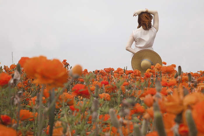 red haired woman in orange flowers, San Diego, CA, United States