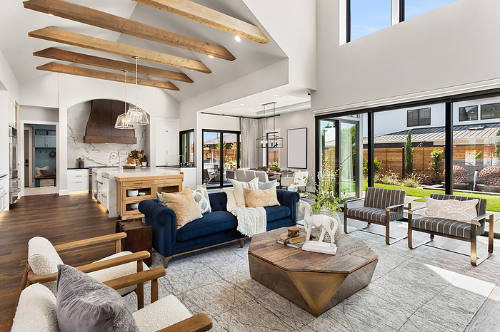Living room and kitchen interior in new luxury home with large windows, Portland, OR, United States