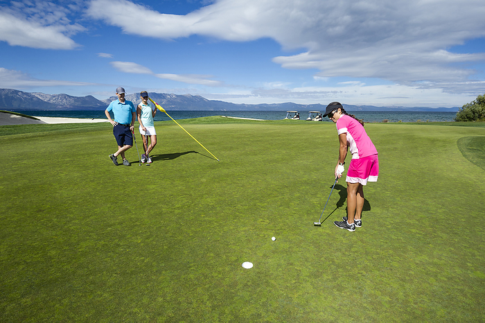 Friends playing golf at Edgewood Tahoe in Stateline, Nevada., United States, Nevada, Stateline
