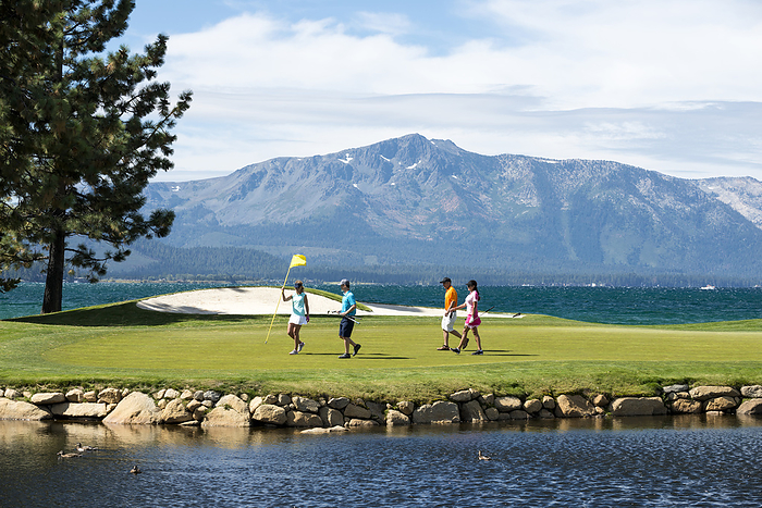 A group of friends golfing at Edgewood Tahoe in Stateline, Nevada., United States, Nevada, Stateline