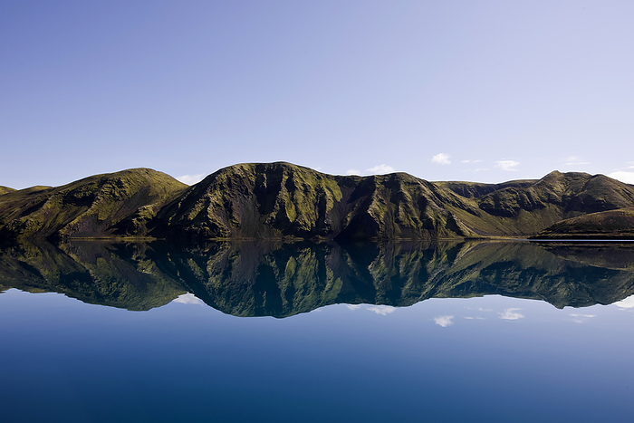 Iceland reflection of mountain range in still lake on the Icelandic highlands, Kirkjub jarklaustur, Iceland