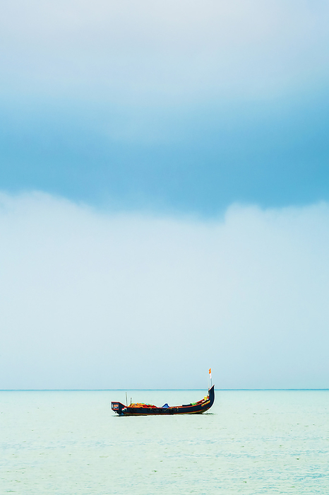 Fishing boat on Arabian Ocean with Monsoon clouds, off popular Marari Beach  Mararikulam, Alappuzha  Alleppey , Kerala, India Fishing boat on Arabian Ocean with Monsoon clouds, off popular Marari Beach, Mararikulam, Alappuzha  Alleppey , Kerala, India, Asia, Photo by Robert Francis