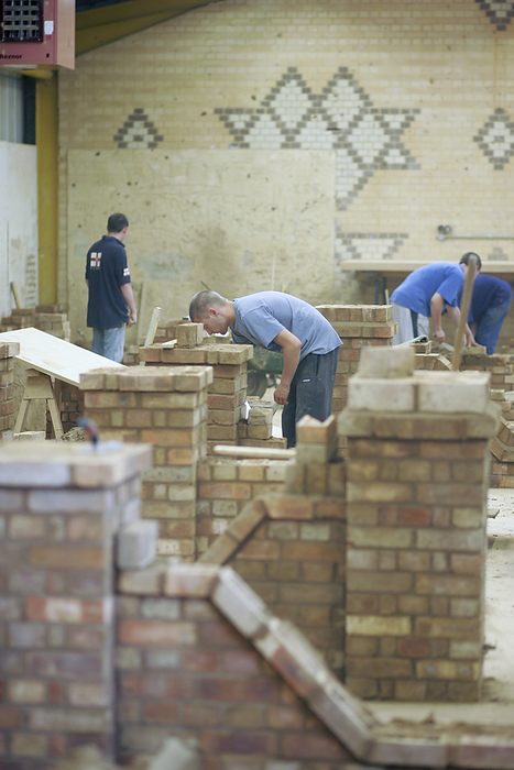 Bricklaying training Construction apprentices practicing bricklaying.