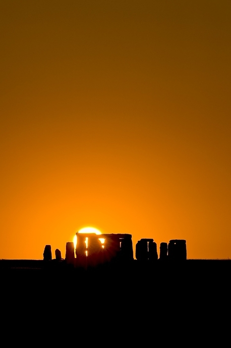Stonehenge at sunset Stonehenge at sunset. This ancient arrangement of large standing stones  megaliths  on Salisbury Plain, England, is thought to have been built around 2000 BC by neolithic peoples. Some of the stones are thought to form markers that indicate rising and setting points for the Sun and the Moon, allowing accurate prediction of forthcoming lunar and solar eclipses.