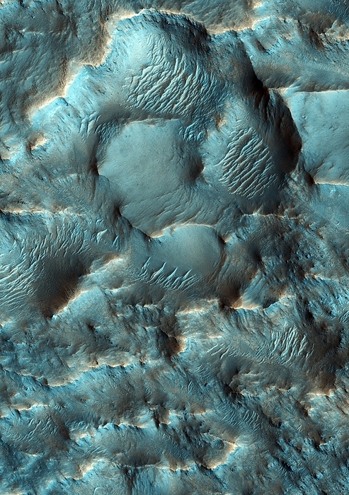 Terra Sirenum region, Mars Terra Sirenum region, Mars, coloured satellite image. This region, in the southern hemisphere, is heavily cratered. Spectrometer analysis of the rocks show the presence of ancient  3.5   3.9 billion year old  chloride and phyllosilicate minerals, which are strongly associated with the presence of water. Image obtained by the High Resolution Imaging Science Experiment  HiRISE  camera on NASA s Mars Reconnaissance Orbiter  MRO  on 24th April 2009. The width of this image is roughly one kilometre across.