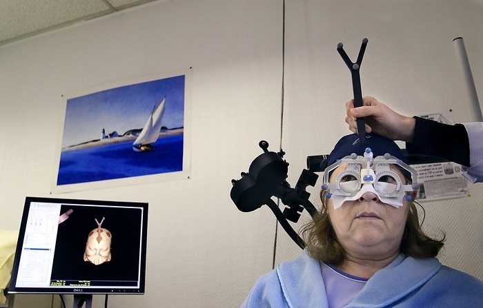 Magnetic therapy for depression Magnetic therapy for depression. Patient with severe depression being prepped for treatment using transcranial magnetic stimulation  TMS . TMS uses localised pulses of magnetic fields to stimulate increased activity in the left frontal lobe, the area of the brain associated with mood disorders. The  glasses  are being used to help ensure the precise positioning of the patient s head, which can be seen on the computer screen. Photographed at the Henri Mondor hospital, Creteil, Paris, France.