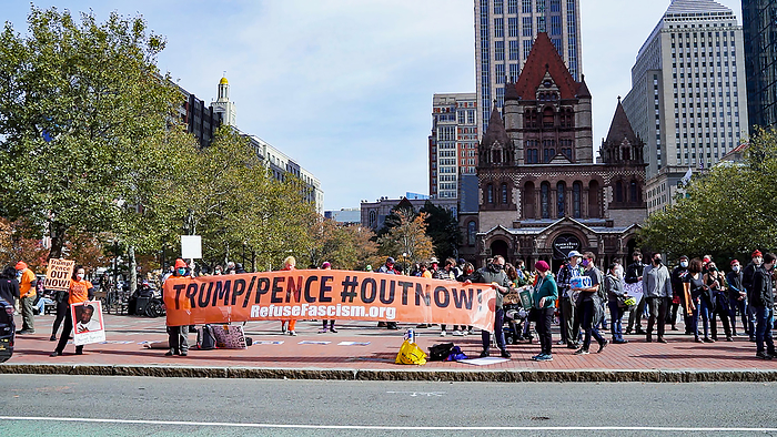 Anti Trump counter protest in Boston October 18, 2020, Copley Square, Boston, Massachusetts, USA: Counter protesters holds  Trump Pence out now  across from a rally in support of U.S. President Donald Trump in Boston.  Photo by Keiko Hiromi AFLO  