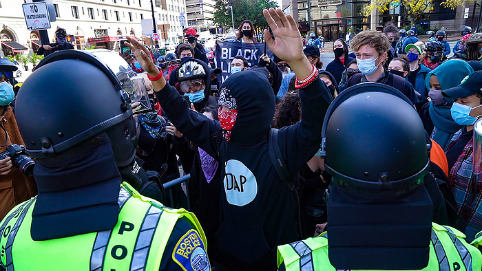 Anti Trump counter protest in Boston October 18, 2020, Copley Square, Boston, Massachusetts, USA: A counter protesters argue with Boston Police with his hands up at an entry point of a rally in support of U.S. President Donald Trump sponsored by Super Happy Fun America, in Boston. The rally was closed and guarded by Boston Police.  Photo by Keiko Hiromi AFLO  