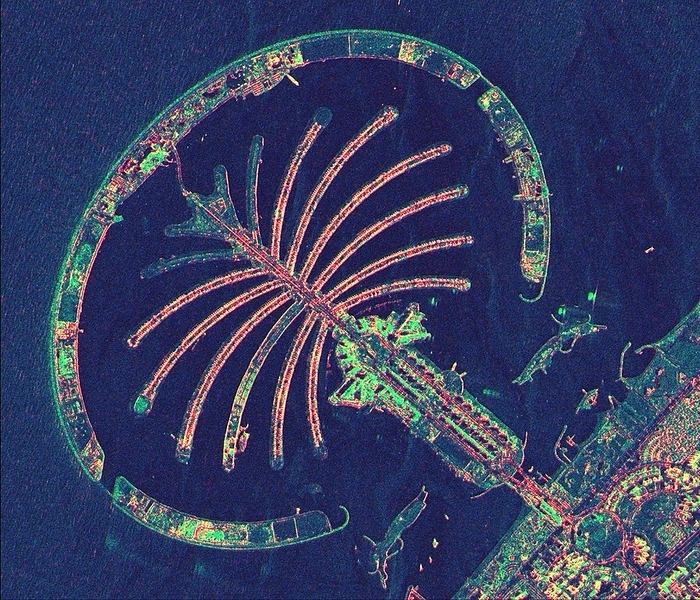 Palm Jumeirah, satellite radar image Palm Jumeirah, satellite radar image. North is at top. The Palm Jumeirah is a collection of artificial islands built in the shape of a palm tree on the Persian Gulf coast of Dubai, in the United Arab Emirates  UAE . Construction began in 2001, with some hotels and apartments in use by 2008. The colours in the image indicate different reflectivity of the radar used to obtain the image. This image, showing an area around 6.6 kilometres across, was obtained by the TerraSAR X satellite on 16 March 2008. This is a European satellite that uses X band  microwave  synthetic aperture radar  SAR  to observe the Earth from space.