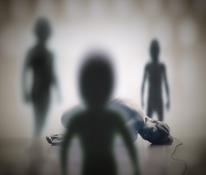 Alien abduction Alien abduction. Comatose human female surrounded by shadowy humanoid alien forms who have abducted her for examination on an alien spacecraft.