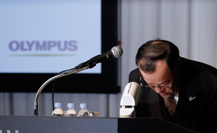 Olympus Loss Concealment Problem Extraordinary General Meeting of Shareholders to be held in March December 15, 2011, Tokyo, Japan   Shuichi Takayama, president of Japan s Olympus Corp., bows before leaving a news conference in Tokyo on Thursday, December 15, 2011. Takayama said the scandal hit company would aim to hold an extraordinary shareholder meeting in March or April in the wake of demands by foreign investors to overhaul management following the discovery of an accounting fraud. Takayama said the scandal hit company would aim to hold an extraordinary shareholder meeting in March or April in the wake of demands by foreign investors to overhaul management following the discovery of an accounting fraud.  The 92 year old camera and endoscope maker submitted its overdue revised earnings statement to the Financial Services Agency three hours before the The 92 year old camera and endoscope maker submitted its overdue revised earnings statement to the Financial Services Agency three hours before the deadline Wednesday to avoid being axed from the Tokyo Stock Exchange. for the April to September quarter, the company booked a net loss of  413 million For the April to September quarter, the company booked a net loss of  413 million against a year earlier profit of  38 million due mainly to one time losses caused by market deterioration, Thai floods and a decline in the book value of its business assets. Olympus delayed the filing pending the findings of an independent investigation into schemes that used inflated payments for acquisitions to hide about  1.5 billion in net loss of  413 million against a yearearlier profit of  38 million due mainly to one time losses caused by market deterioration, Thai floods and a decline in the book value of its business assets. Olympus delayed the filing pending the findings of an independent investigation into schemes that used inflated payments for acquisitions to hide about  1.5 billion in losses from the 1990s.  Photo by Natsuki Sakai AFLO   3615   mis 