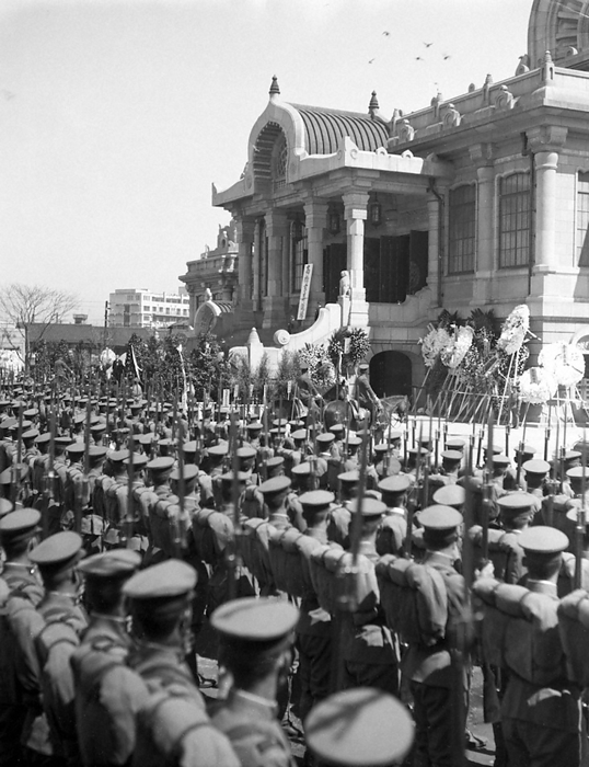 Funeral procession of Minister of Finance Korekiyo Takahashi, who was assassinated in the 2 26 Incident The funeral of Minister of Finance Korekiyo Takahashi, who was assassinated in the February 26 Incident, took place one month later at Tsukiji Honganji Temple. Army soldiers line up in front of the main hall of Tsukiji Honganji Temple to offer salute with their bayonets, March 26, 1936, in Chuo ku, Tokyo.