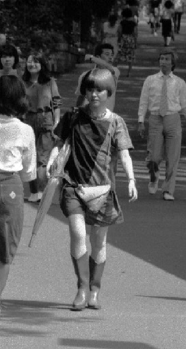 Harajuku Culture  Taken June 1980  Women with various hairstyles walking in Harajuku  circa June 1980 : Tokyo leads Japan s youth fashion. Harajuku is the most cutting edge area in Tokyo. Young people gather from everywhere and create new clothes and customs one after another. Young women in Harajuku have a wide variety of hairstyles, from short to long, Japanese, Western, African, and so on. In addition, their hair is colorfully dyed gold, pink, green, gray, etc. It is also common to see frizzy hair. Some of the hairstyles are of unknown nationality. I was worried about their hair, which is a woman s life, but they said to me,  It s old, it s old. A hat, instead of a hat. Or a wig. They replied in a matter of fact manner.