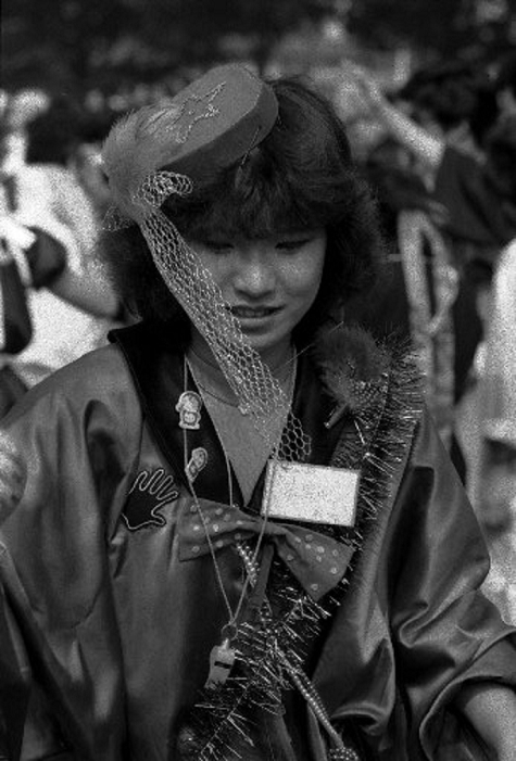 Harajuku Culture  Taken in June 1980  Women with various hairstyles walking in Harajuku  around June 1980 : Tokyo is the leader in youth fashion in Japan. Harajuku is the most advanced area in Tokyo. Young people gather here from everywhere, and one after another, new clothes and customs are born. The hairstyles of young women in Harajuku vary from short to long, Japanese, Western, African, and so on. In addition, they dye their hair gold, pink, green, gray, and other colorful colors. Frizzy hair is also common. Some of them even have hair of unknown nationality. I worry that hair is a woman s life, but they say,  Old fashioned, old fashioned. It s a hat, instead of a hat. Or a wig. They replied in a matter of fact manner.