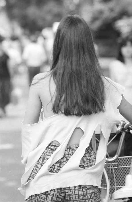 Harajuku Culture  Taken in 1985  Borolook  1985 : A young woman wearing a tattered T shirt goes about town. Harajuku, Tokyo.