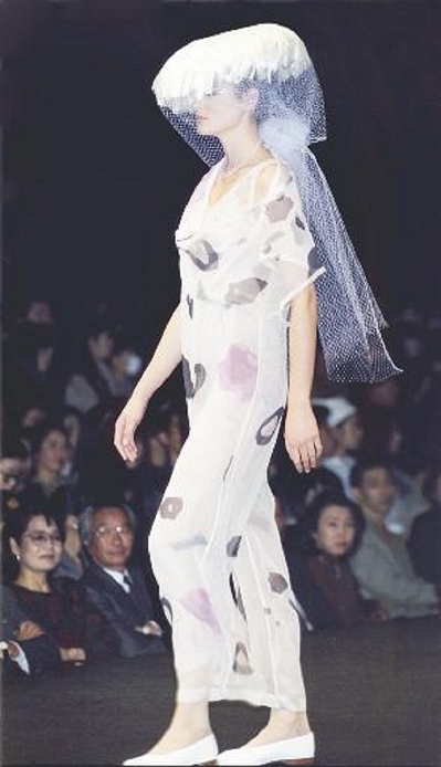    1991 Spring Summer Tokyo Collection Comme des Garcons fashion show. Work by Rei Kawakubo. Print pattern of microscopic photographs of ores. At a special tent in the National Stadium in Yoyogi, Tokyo.  November 1990 