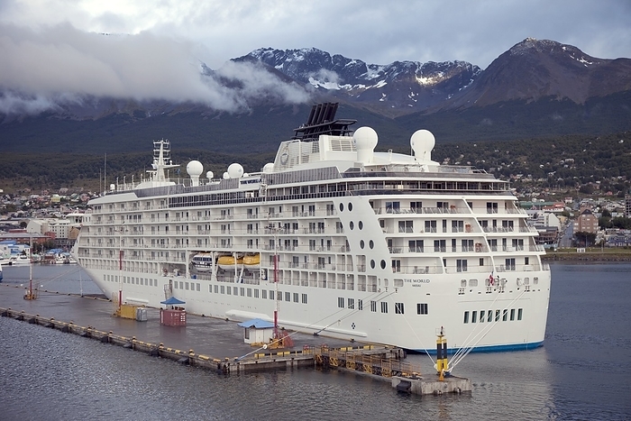 MS The World, cruise ship MS The World, a luxury residential cruise ship, here moored at the port of Ushuaia, the provincial capital of Tierra del Fuego, Argentina. This ship was launched in 2002, and consists of residential units for around 200 300 people, along with a crew of 250. It slowly circumnavigates the globe, with some residents living on board full time and others joining and leaving the ship. Tierra del Fuego is an archipelago at the southernmost tip of South America. Photographed in 2011.