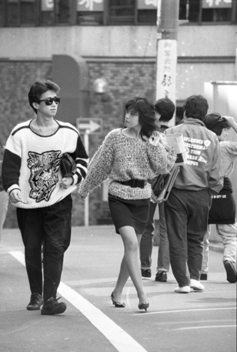  Caution: A woman in a miniskirt walking on the street  October 21, 1987  A woman in a miniskirt walking down the street.