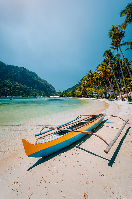 Traditional wooden banca boat on beautiful Las Cabanas beach. Summer vacations, Island hopping, El Nido, magic of Philippines Traditional wooden banca boat on beautiful Las Cabanas beach. Summer vacations, Island hopping, El Nido, magic of Philippines., Photo by Miniloc